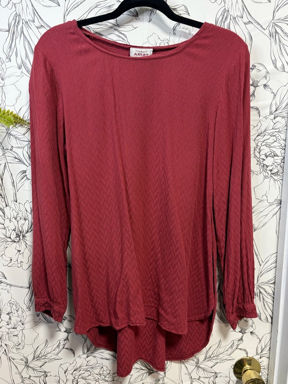 Ariat Women's High-Low, Long Sleeve Top in rich Deep Brick color